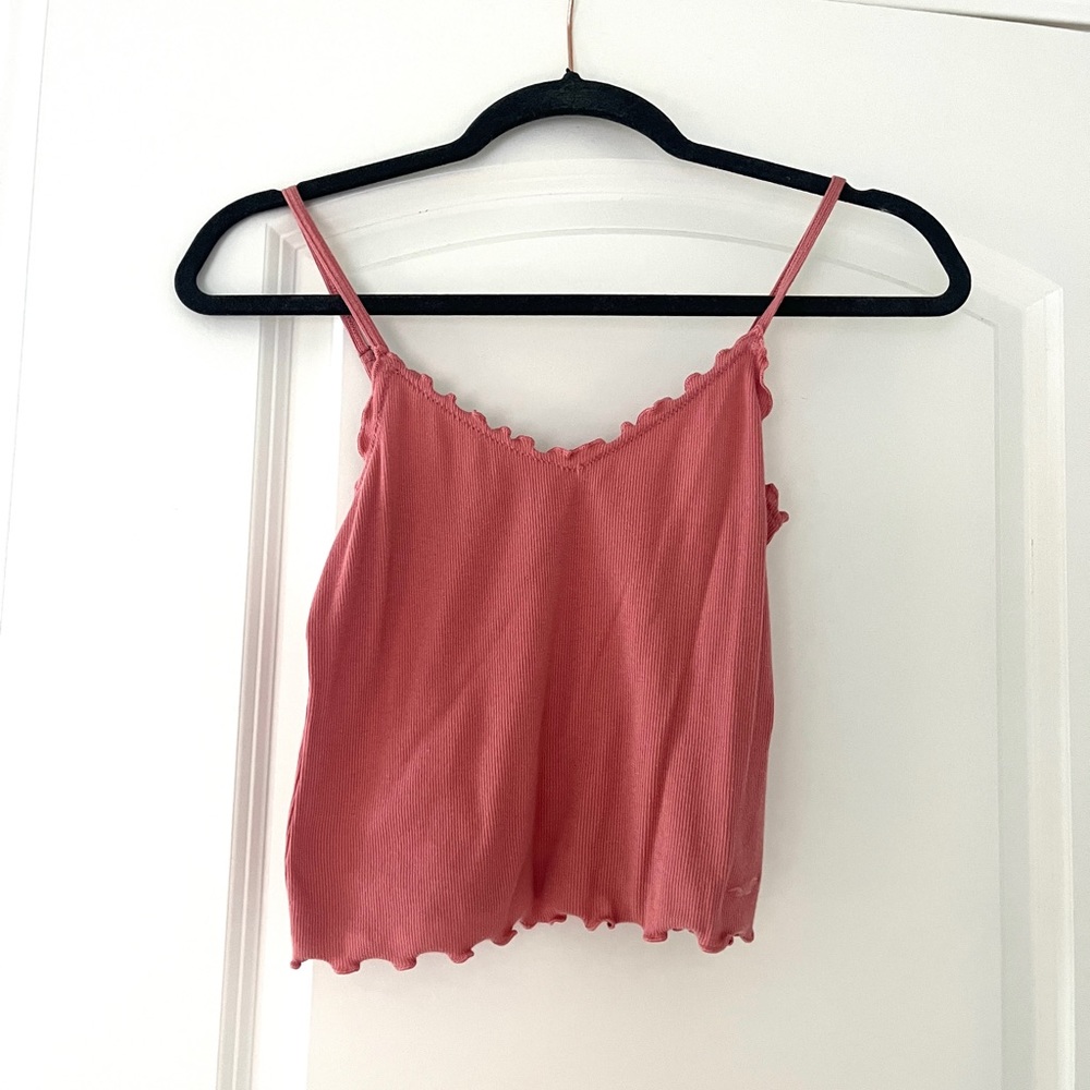 Pink tank top with small ruffles at the top. Worn once, in perfect condition!